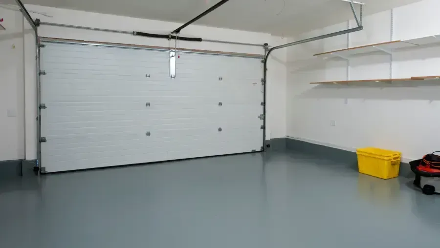Empty, bright hallway leading to a bright window at the end.